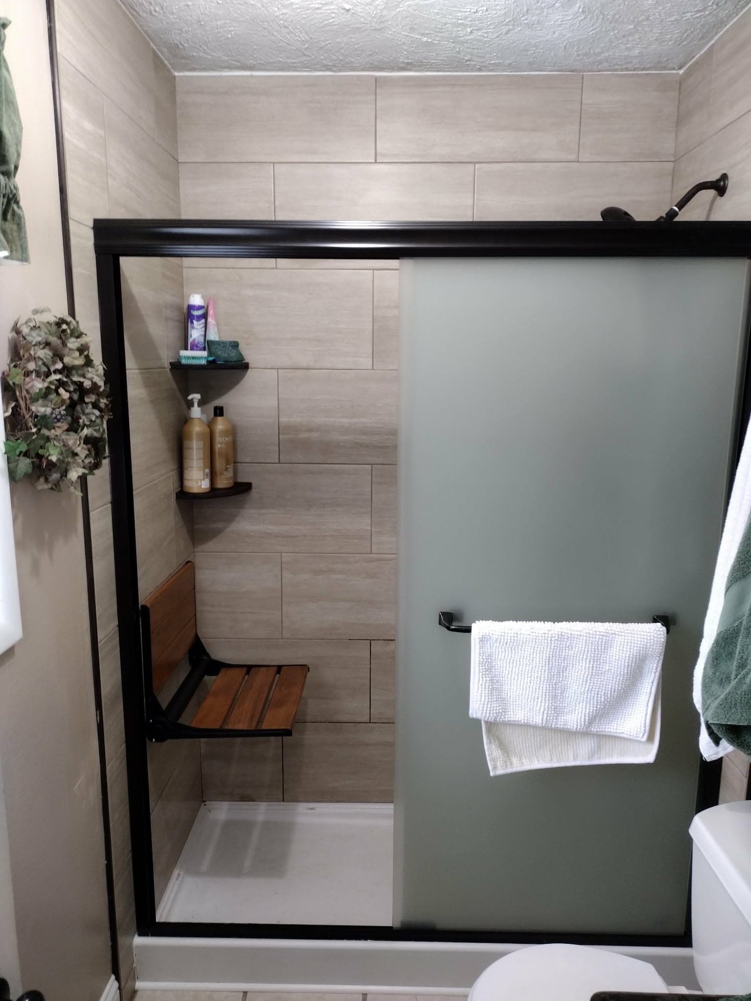 Modern bathroom renovation with new fixtures and tile